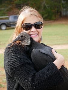 MAC with Elroy, our imprinted Black Vulture. A member of the public raised him to think like a pet so he is unable now, to live on his own in the wild. (Normal vultures don't do this!)