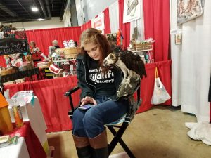 Oscar, our Osprey assisting MAC with her texting during a break at the Convention Center. (He's great with grammar, btw!)